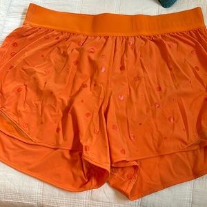 Lululemon shorts size 12 Orange in color with lululemon logo